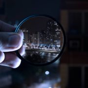 person holding magnifying glass